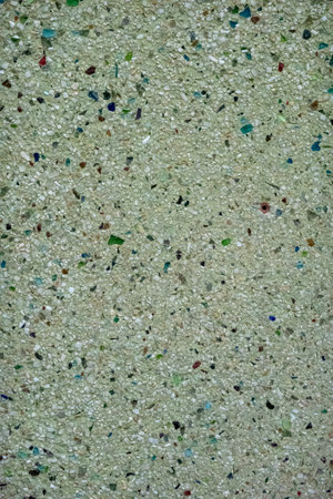 Close view of a Wall texture of a mixture of cement and broken glass.の写真素材