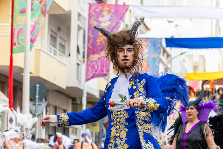 LOULE, PORTUGAL - 20th FEBRUARY 2023: Colorful Carnival (Carnaval) Parade festival participants on Loule city, Portugal.のeditorial素材