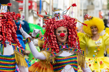 LOULE, PORTUGAL - 20th FEBRUARY 2023: Colorful Carnival (Carnaval) Parade festival participants on Loule city, Portugal.のeditorial素材