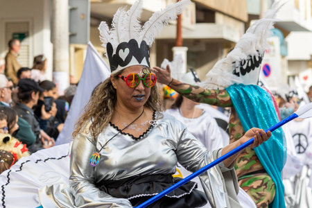 LOULE, PORTUGAL - 20th FEBRUARY 2023: Colorful Carnival (Carnaval) Parade festival participants on Loule city, Portugal.のeditorial素材