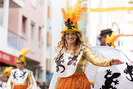 LOULE, PORTUGAL - 23rd FEBRUARY 2023: Colorful Carnival (Carnaval) Parade festival participants on Loule city, Portugal.のeditorial素材