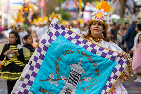 LOULE, PORTUGAL - 23rd FEBRUARY 2023: Colorful Carnival (Carnaval) Parade festival participants on Loule city, Portugal.のeditorial素材