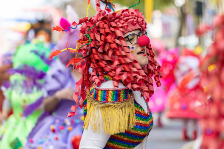 LOULE, PORTUGAL - 23rd FEBRUARY 2023: Colorful Carnival (Carnaval) Parade festival participants on Loule city, Portugal.のeditorial素材