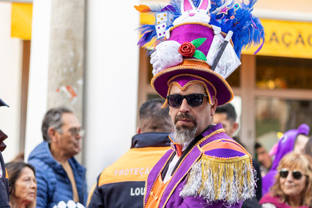 LOULE, PORTUGAL - 23rd FEBRUARY 2023: Colorful Carnival (Carnaval) Parade festival participants on Loule city, Portugal.のeditorial素材