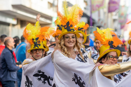 LOULE, PORTUGAL - 23rd FEBRUARY 2023: Colorful Carnival (Carnaval) Parade festival participants on Loule city, Portugal.のeditorial素材