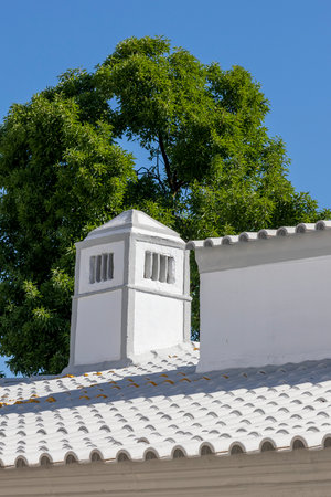 Traditional Portuguese chimney over a blue sky.の写真素材