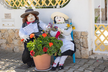SANTA RITA, PORTUGAL - MAY 1st, 2023: ancient tradition of handmade dolls called maios / maias, celebrating the arrival of spring, located on the algarve region, the south of portugal.のeditorial素材