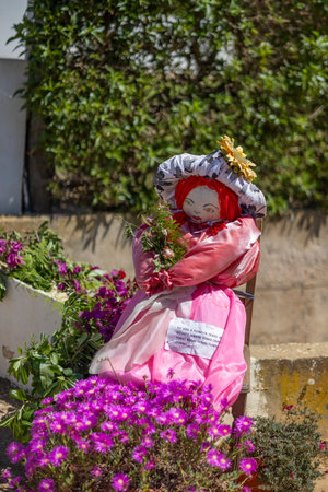 MANTA ROTA, PORTUGAL - MAY 1st, 2023: ancient tradition of handmade dolls called maios / maias, celebrating the arrival of spring, located on the algarve region, the south of portugal.のeditorial素材