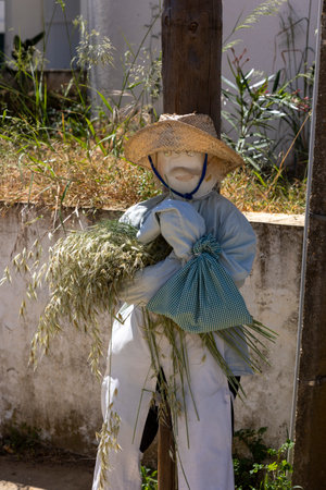MANTA ROTA, PORTUGAL - MAY 1st, 2023: ancient tradition of handmade dolls called maios / maias, celebrating the arrival of spring, located on the algarve region, the south of portugal.のeditorial素材