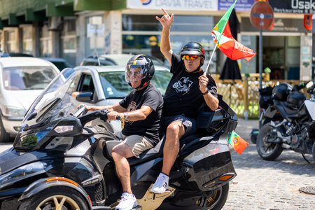FARO, PORTUGAL - 24th JULY, 2023: Parade of several motorcyclists on the road for the 41st International Motorcycle Festival as a goodbye for the next year. There are nationalities from all over the world that participate and is considered one of the bestのeditorial素材