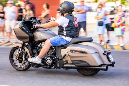 FARO, PORTUGAL - 24th JULY, 2023: Parade of several motorcyclists on the road for the 41st International Motorcycle Festival as a goodbye for the next year. There are nationalities from all over the world that participate and is considered one of the bestのeditorial素材