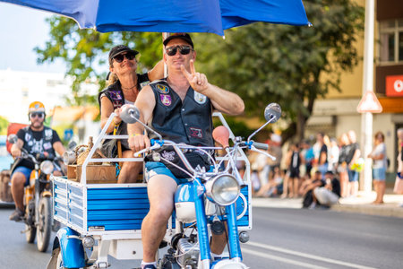 FARO, PORTUGAL - 24th JULY, 2023: Parade of several motorcyclists on the road for the 41st...