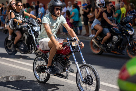 FARO, PORTUGAL - 24th JULY, 2023: Parade of several motorcyclists on the road for the 41st International Motorcycle Festival as a goodbye for the next year. There are nationalities from all over the world that participate and is considered one of the bestのeditorial素材