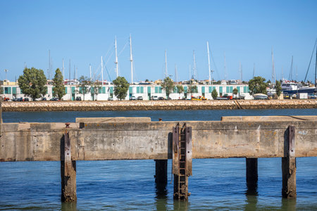 View of an old pier of Portimao city, Algarve region, Portugal.の写真素材