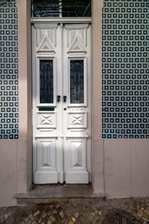Close view of the typical architecture of Algarve buildings with intricate and different doors, located in Portugal, Europe.の写真素材