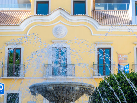 PORTIMAO, PORTUGAL - 29th JULY 2023: Beautiful water fountain in urban park 1st of december located in Portimao city, Portugal.のeditorial素材