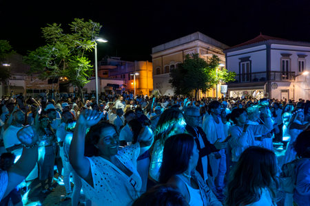 LOULE, PORTUGAL: 26th AUGUST 2023 - An event called White Night, where everybody dresses white clothing and watches shows, concerts and performances.のeditorial素材