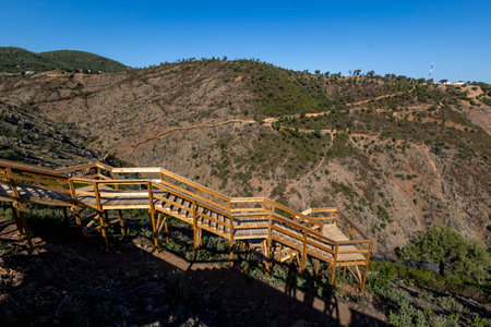 Wooden path on the mountain ideal for nature walks, located near Alferce village, Portugal.