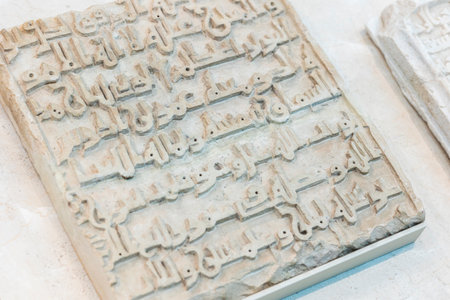 Malaga, Spain - October 21, 2023: Pieces of cuneiform writing Arabic tablet from the collection of Loringiana, located on Malaga museum, Spain.のeditorial素材