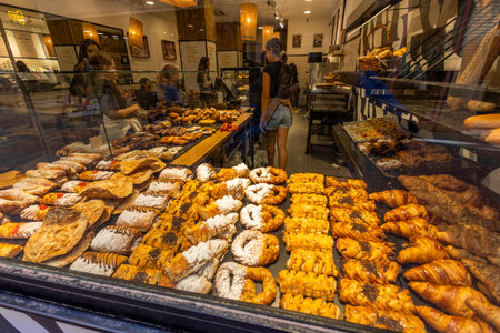 Malaga, Spain - October 21, 2023: Close view of the diverse pastries and cakes inside a shop in Malaga, Spain.のeditorial素材
