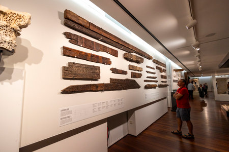 Malaga, Spain - October 21, 2023: Display of recovered wooden pieces of roman origin at Museum on Museum in Spain.のeditorial素材