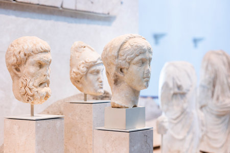 Malaga, Spain - October 21, 2023: Display of pieces of roman busts on Museum in Spain.のeditorial素材