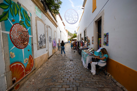 FARO, PORTUGAL: 7th SEPTEMBER, 2023 - Sellers sell clothing and accessories in music Festival F, a big festival in the city of Faro, Portugal.のeditorial素材