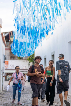 FARO, PORTUGAL: 7th SEPTEMBER, 2023 - Young female teen visitors arrive at music Festival F, a big festival in the city of Faro, Portugal.のeditorial素材