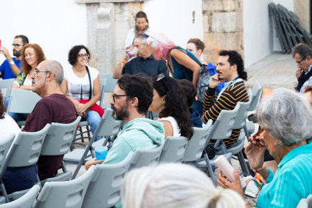 FARO, PORTUGAL: 9th SEPTEMBER, 2023 -Audience watches with attention an interview in Festival F, a big festival in Faro, Portugal.のeditorial素材