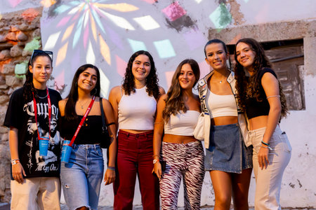 FARO, PORTUGAL: 9th SEPTEMBER, 2023 - Young female teen visitors arrive at music Festival F, a big festival in the city of Faro, Portugal.のeditorial素材