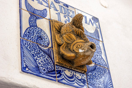 Typical azulejo decorations next the entrance of a door in the Algarve region, Portugal.の写真素材