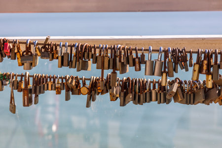 Close up view of a Row of rusty padlocks left by loving couples.の写真素材