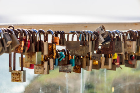 Close up view of a Row of rusty padlocks left by couples.の写真素材