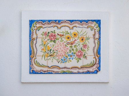 Typical azulejo decorations next the entrance of a door in the Algarve region, Portugal.の写真素材