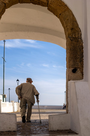Close view of a lonely old man walking.の写真素材