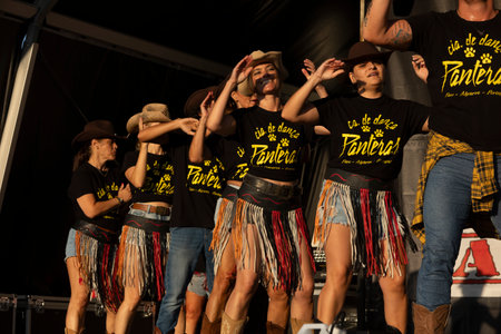 FARO, PORTUGAL, 04th August 2024: American Cars Show Algarve Event with vintage cars and a mix of Americana related activities happening, including pinup shows, rockabilly concerts and dance groups, among others.のeditorial素材