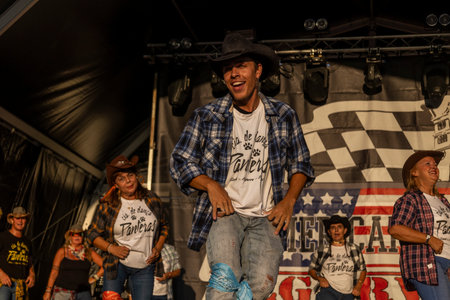 FARO, PORTUGAL, 04th August 2024: American Cars Show Algarve Event with vintage cars and a mix of Americana related activities happening, including pinup shows, rockabilly concerts and dance groups, among others.のeditorial素材