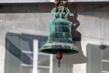 Close up view of an old rusty bronze metal bell.の写真素材