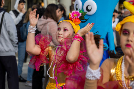 QUARTEIRA, PORTUGAL - 13th FEB 2024: Colorful Carnival (Carnaval) Parade festival participants on Quarteira city, Portugal.のeditorial素材