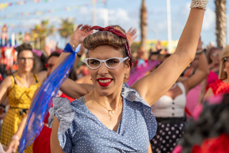 QUARTEIRA, PORTUGAL - 13th FEB 2024: Colorful Carnival (Carnaval) Parade festival participants on Quarteira city, Portugal.のeditorial素材
