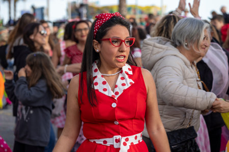QUARTEIRA, PORTUGAL - 13th FEB 2024: Colorful Carnival (Carnaval) Parade festival participants on Quarteira city, Portugal.のeditorial素材