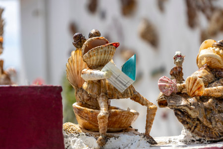 Close up view of a Figure of toads made with seashells,