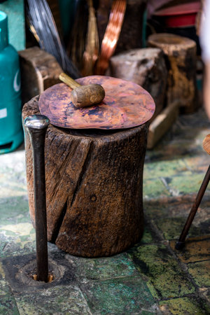 Old stump on a copper workshop used for shaping copper to pans for example.の写真素材