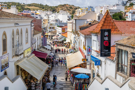 ALBUFEIRA, PORTUGAL - 7th MAY 2024: Traditional Portuguese architecture of houses in the region of Albufeira, Portugal.のeditorial素材