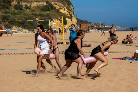 ALBUFEIRA, PORTUGAL - 7th MAY 2024: Group of women having a bachelorette party on a beach in Albufeira, Portugal.のeditorial素材
