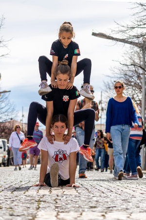 LOULE, PORTUGAL - 17th MARCH 2024: Girls performing an exercise maneuver for promotion of exercise and healthy hobbies.のeditorial素材