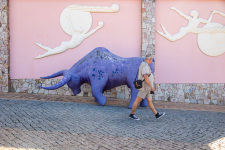 ESTOMBAR, PORTUGAL - 5th OCOTOBER 2024: Artistic plaster modern contemporary purple bull statue located on wine estate "Quinta dos Vales".のeditorial素材