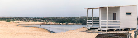 Close view of a white lifeguard wooden hut in Salgados beach, Algarve, Portugal.
