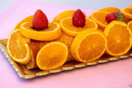 Typical oranged roll cake on a table.の写真素材