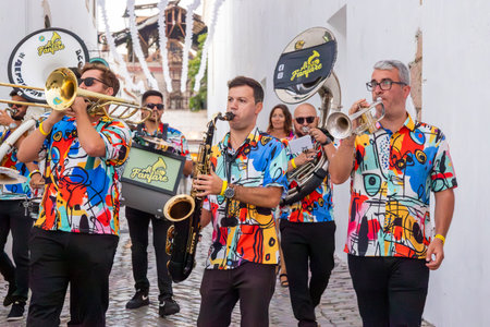 FARO, PORTUGAL: 5th SEPTEMBER, 2024 - Street music group Al-Fanfare performers play in the street at Festival F, a big festival on the city of Faro, Portugalのeditorial素材